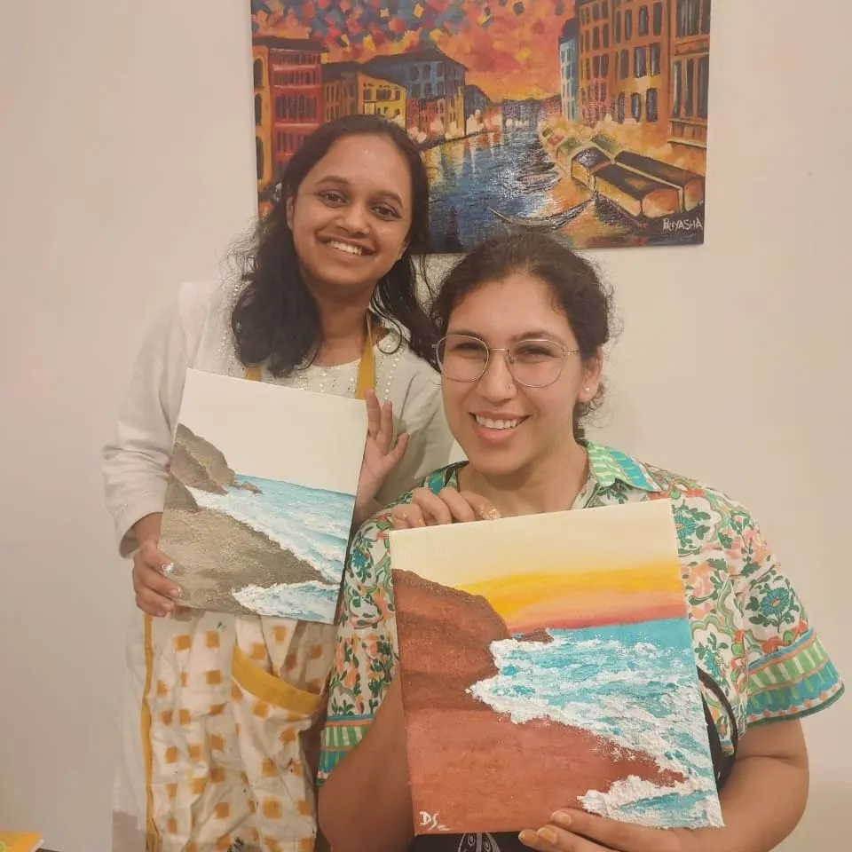 Coastal Painting Workshop: artist and participant with artworks