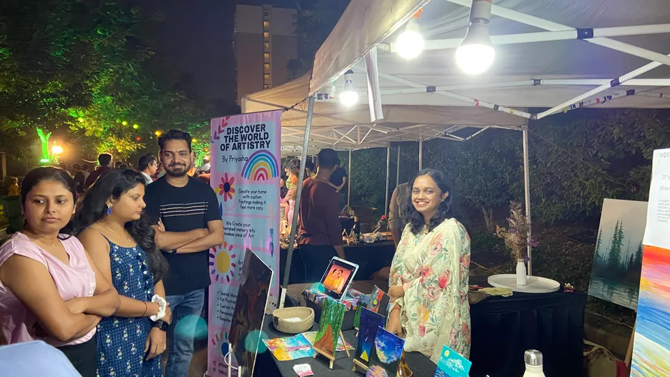 Sobha Art Booth 2023: artist in visitor conversation 1
