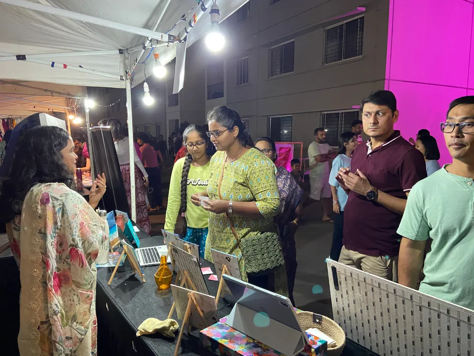 Sobha Art Booth 2023: artist in visitor conversation 3